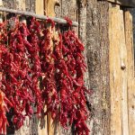 Red chilies drying in the sun on a Bhutan farmhouse
