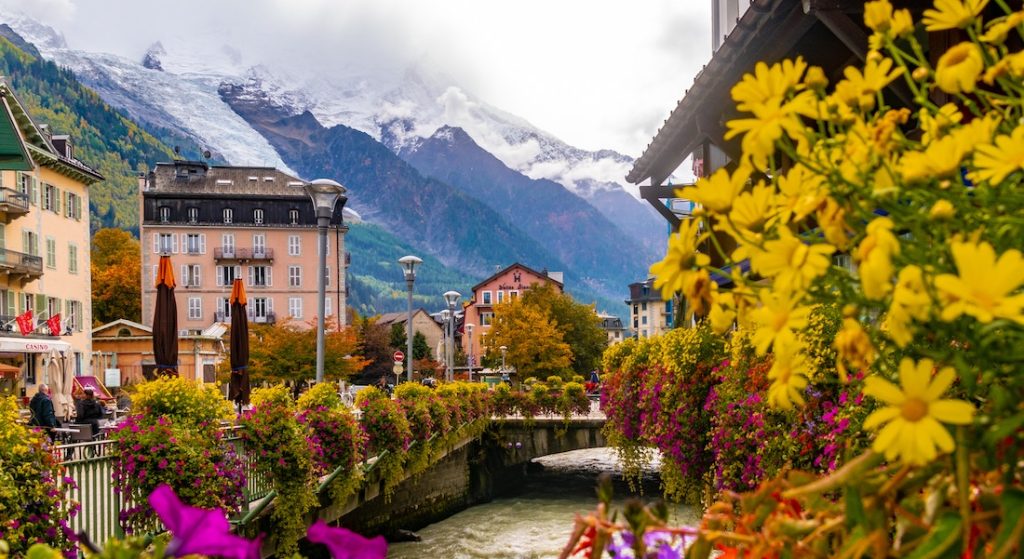 View of Chamonix, France, with colorful flowers in the foreground