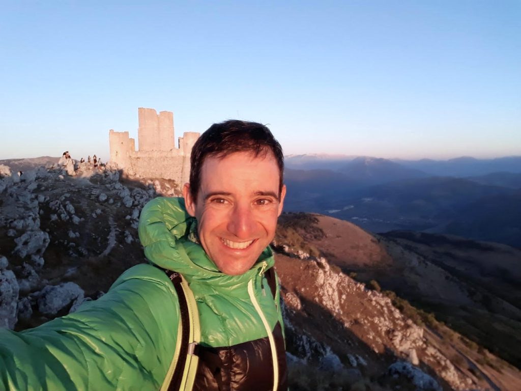 Man's selfie with Dolomites mountains in background