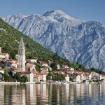 View across the water of village and mountains in Montenegro