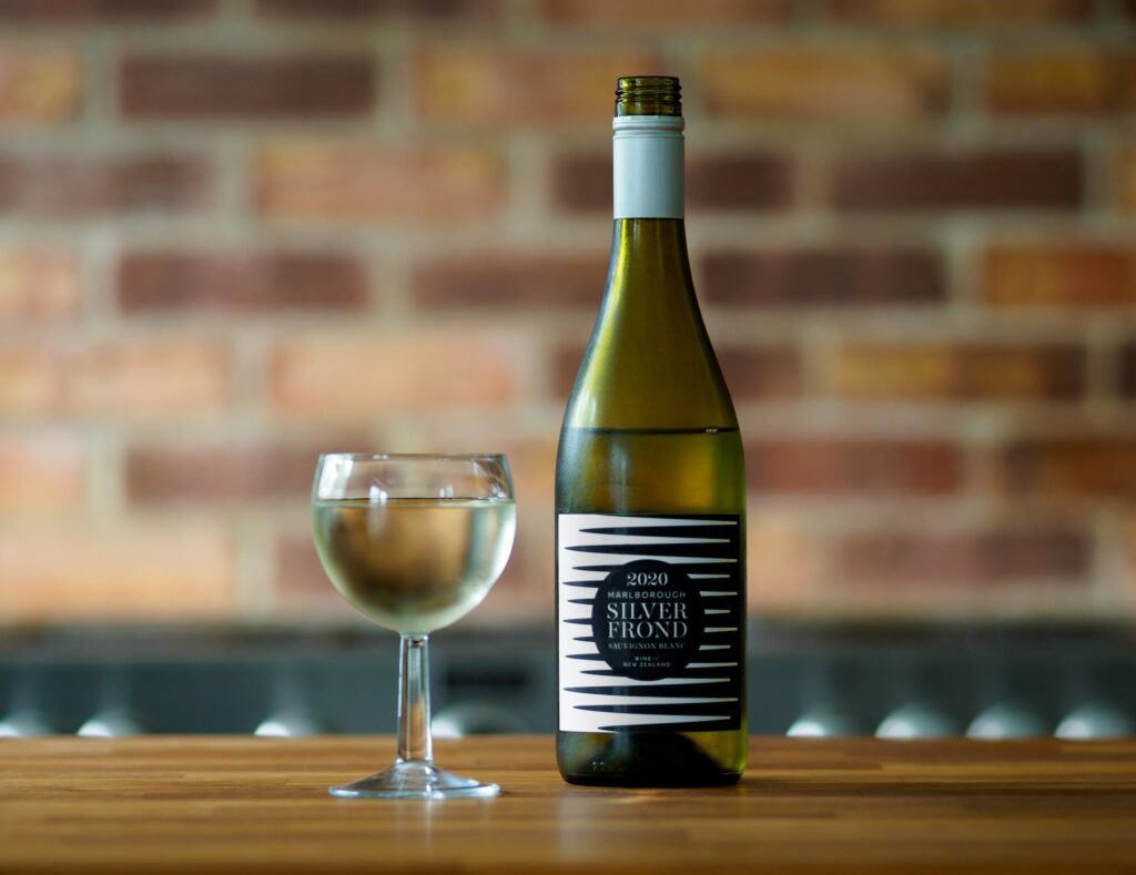A bottle of Marlborough Sauvignon Blanc with glass beside