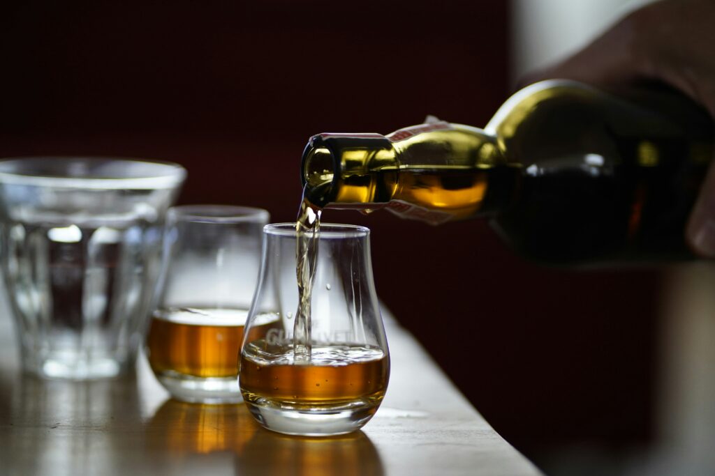 Pouring two glasses of whisky