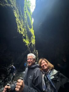 Couple smiling in a canyon in Iceland.