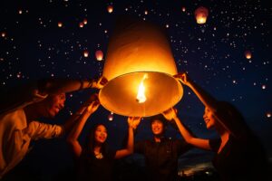 Asian couple traveller yi peng Thailand lantern festival in loi krathong festivities celebration in chiang mai, Thailand photo